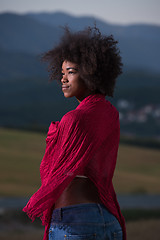 Image showing outdoor portrait of a black woman with a scarf