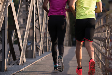 Image showing multiethnic couple jogging in the city