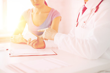 Image showing patient and doctor prescribing medication