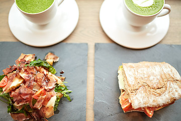 Image showing salad, sandwich and matcha green tea at restaurant