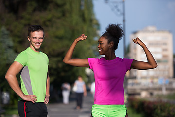 Image showing portrait of young multietnic jogging couple ready to run