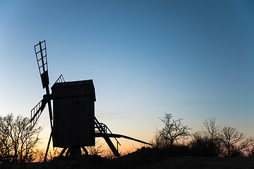 Image showing Old wooden windmill silhouette