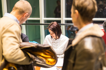 Image showing Personal assistant working at registration desk at corporate event.