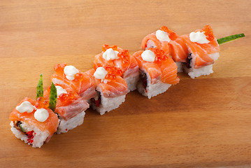 Image showing Closeup japanese sushi on wooden plate