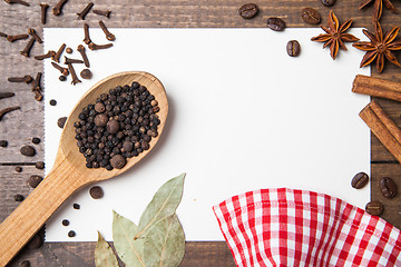 Image showing paper for recipes and spices on wooden table