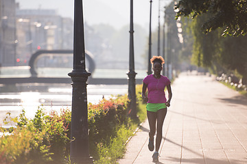 Image showing african american woman jogging in the city