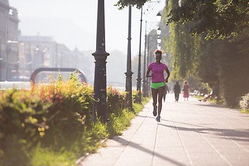 Image showing african american woman jogging in the city