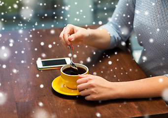 Image showing close up of woman with smartphone and coffee