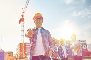 Image showing builders pointing finger at you on construction