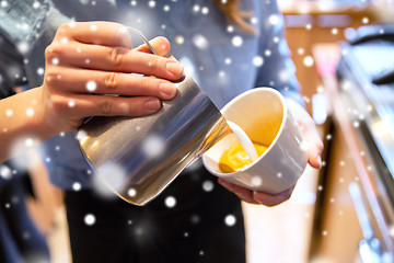 Image showing close up of woman making coffee at shop or cafe