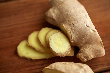 Image showing close up of ginger root on wooden table