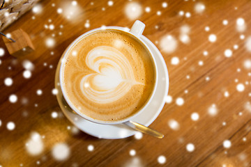 Image showing close up of coffee cup with heart shape drawing