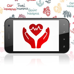 Image showing Insurance concept: Smartphone with Heart And Palm on display