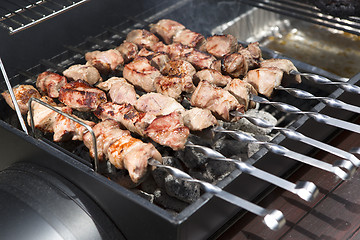 Image showing Grilling shashlik on a barbeque grill outdoor