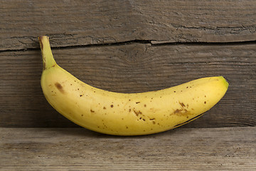 Image showing Yellow banana on wooden background  