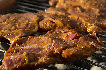 Image showing Closeup of pork on a BBQ grill