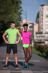 Image showing portrait of young multietnic jogging couple ready to run