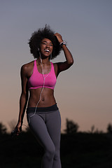 Image showing black woman is doing stretching exercise relaxing and warm up