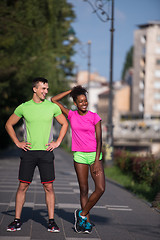 Image showing portrait of young multietnic jogging couple ready to run