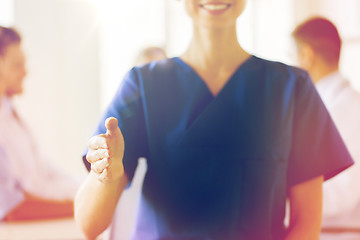 Image showing close up of doctor reaching out hand at hospital