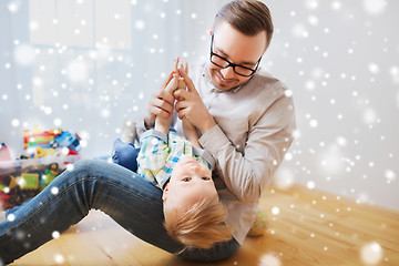 Image showing father with son playing and having fun at home