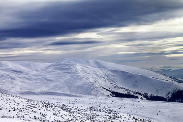 Image showing Winter mountains and gray sky before blizzard