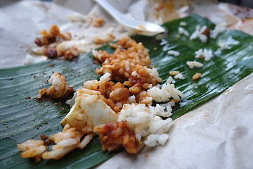 Image showing Leftover rice on banana leave