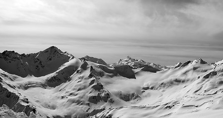 Image showing Black and white panorama of Caucasus Mountains in snow winter ev