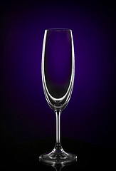 Image showing Empty wine glass on dark red