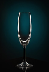 Image showing Empty wine glass on dark red