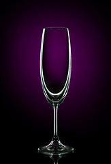 Image showing Empty wine glass on dark red