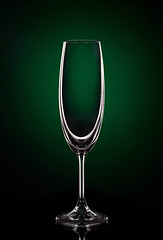 Image showing Empty wine glass on dark red