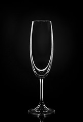 Image showing Empty wine glass on dark red