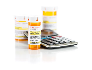 Image showing Calculator and Non-Proprietary Medicine Prescription Bottles Iso