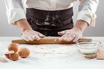 Image showing Hands kneading a dough