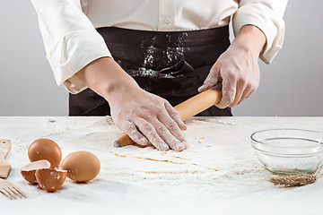 Image showing Hands kneading a dough