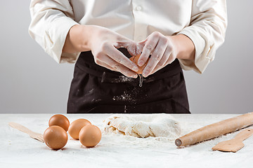 Image showing Hands kneading a dough