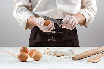 Image showing Hands kneading a dough