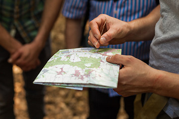 Image showing Navigating with map and compass