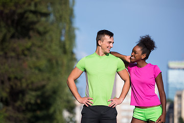 Image showing portrait of young multietnic jogging couple ready to run