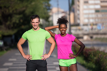 Image showing portrait of young multietnic jogging couple ready to run