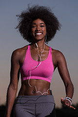 Image showing black woman is doing stretching exercise relaxing and warm up