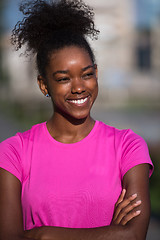 Image showing Portrait of sporty young african american woman running outdoors