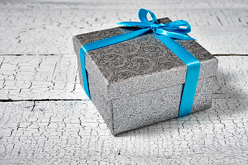 Image showing Gift box with blue ribbon