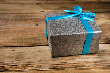 Image showing Gift box with blue ribbon