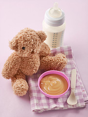 Image showing bowl of pureed apple and baby milk bottle