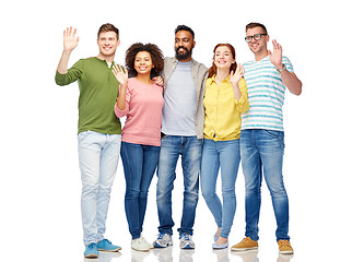 Image showing international group of happy people waving hands