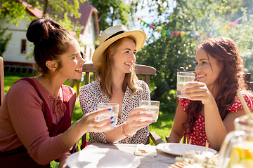 Image showing happy women with drinks at summer garden party
