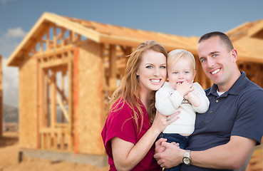 Image showing Young Military Family Outside Their New Home Framing