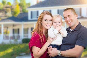 Image showing Young Military Family in Front of Their House